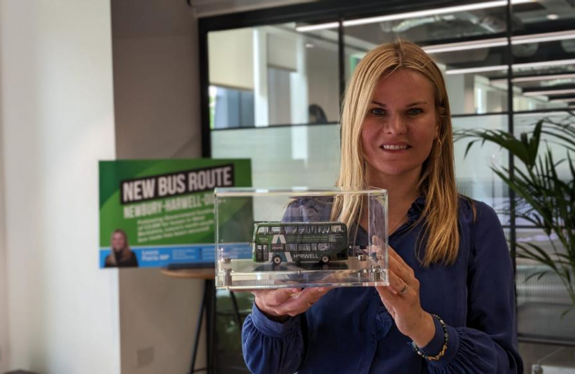 Laura with a model of the new bus